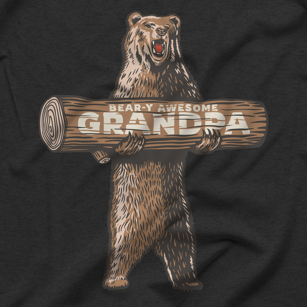 Black t-shirt with a roaring bear holding a log graphic and 'Bear-y Awesome Grandpa' text.
